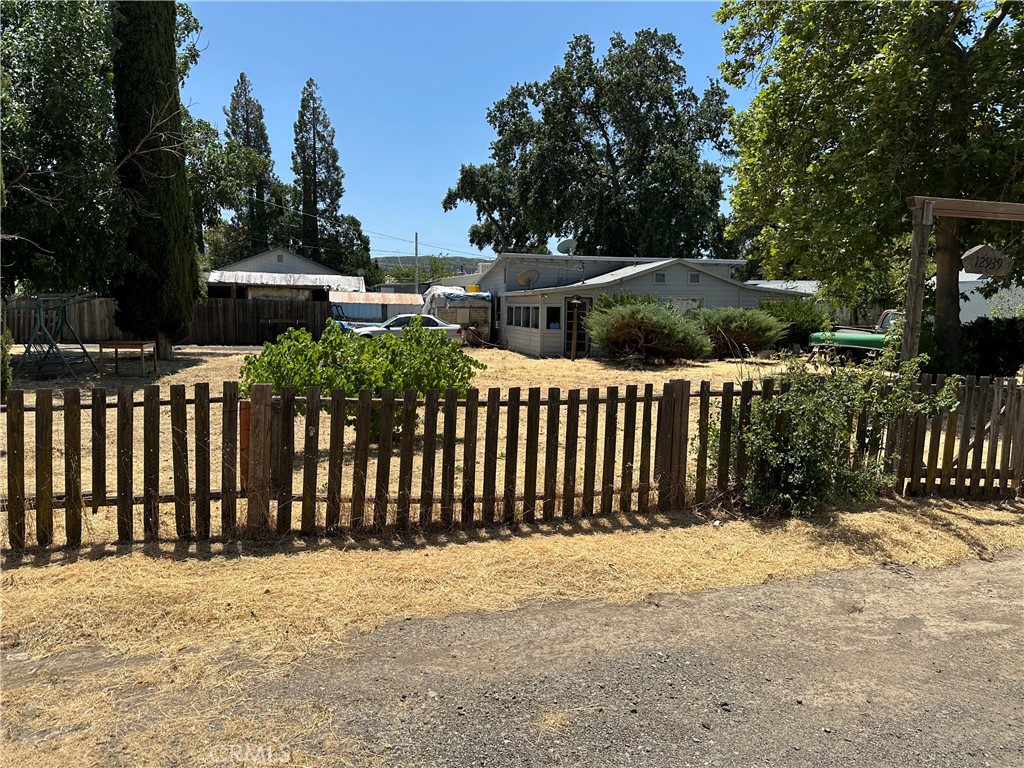 Charming home that need TLC, Spacious living room. Kitchen has lots of cabinets for storage. Large double sized corner lot.