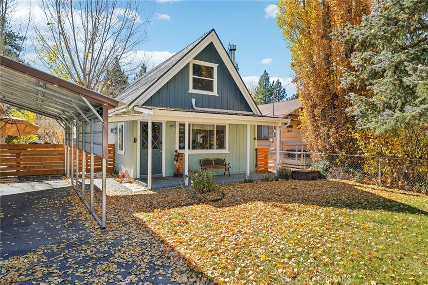 Perfectly situated just a short distance from the Convention Center—home to Oktoberfest, the Tuesday Farmers Market, local restaurants, and shops—this charming and fully turnkey cabin is ideal for personal use or as a short-term rental investment. The inviting open floor plan features a living, dining, and kitchen area under pine ceilings with exposed beams, creating the perfect mountain atmosphere. The updated kitchen includes granite countertops, white shaker cabinetry, stainless steel appliances, and a subway tile backsplash. Two bedrooms are located on the main level with an additional loft space upstairs. The bathroom has been beautifully updated with a tiled bath and shower surround. Enjoy the outdoors with a spacious backyard featuring a Blaze BBQ island, large gas fire pit, and Sundance spa. Additional features include A/C, tankless water heater, laundry room accessed from the primary bedroom, storage shed, fenced yard, carport, front porch entry, and a lovely grassy front yard.