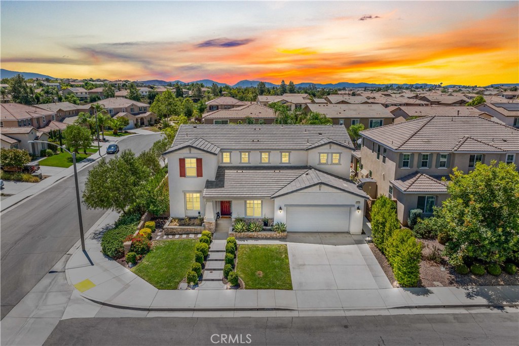 Stunning Spencer's Crossing HOME!! This CHARMING home shows like a MODEL. Sitting on a corner lot of a cul-de-sac walking distance to the Dog Park and Murrieta Schools! Featuring 4 bedrooms, 4 bathrooms and approximately 3199 sq. feet! This home has style, and amazing designer touches you will fall in love with. As you enter in you instantly feel the openness of this floor plan with the high ceilings, custom light fixtures and tons of natural light. Off the entry is your formal dining room that flows into the butler's pantry in this GORGEOUS Gourmet Kitchen!! This kitchen features stainless steel appliances, built-in range, double ovens, range hood, large center island, granite countertops, custom tile backsplash, pendant lighting and is open to a large breakfast nook and family room. Family room offers plenty of space to relax or entertain!! Down the hallway you'll find a mudroom off the direct garage access to your tandem 3-car garage, a stunning power room, and a downstairs bedroom with en-suite bathroom which would make a great in-law suite with plenty of space to add a kitchenette. Head back towards the entry way to find a den/office currently being used as a playroom. This could make an excellent 5th bedroom. Travel up your elegant stairs and find a HUGE loft space, another full bathroom, laundry room, 2 more spacious bedrooms and Primary Suite! You will love the peace and tranquility this bedroom offers, Large walk-in closet, tile flooring and carpet, dual vanities and upgraded tile walk-in shower!! This home is meticulously landscaped with so much thought and care. Enjoy your front porch with custom concrete steps and stone planter beds. The backyard is complete with a lush green lawn and landscaping; the covered California room is perfect to sit and relax complete with lighting and ceiling fan. Some notable features this home offers are a Quiet Cool whole house fan, solar, laminate wood and tile flooring, ceiling fans throughout, window coverings, custom and recessed lighting and so much more! This amenity rich community offers 3 pools, spa, tot pool, clubhouse, private parks, tot lots, basketball and sports courts and is walking distance to Murrieta's Award-Winning schools! Just minutes to the 215, shopping, entertainment and beautiful Temecula Wine Country! This HOME has is all and is ready for someone new to FALL IN LOVE!!