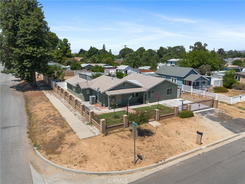 If you've been looking for a home with a large lot and with close freeway access, you've found it. Located just a skip and a hop from both the 10 and 60 freeways, this home offers the convenience of easy freeway access and has a HUGE LOT of just over 9500 sq feet! This home had a BRAND NEW ROOF and BRAND NEW HVAC System installed just 3 years ago in 2022. The kitchen welcomes you with beautiful, ample cabinetry and quartz countertops. You'll love the convenience of indoor laundry. This beautiful home is located on a large corner lot enclosed with a block wall and wrought iron fence. The backyard offers you a huge workshop to store your vehicles, motorcycles, or boat and comes complete with 220V. And don't forget the fruit trees which include avocado, lime, apricot, loquat, and mandarin. While tax records show this home as a 2bd/1bath home, it physically has 4 bedrooms and 2 baths so it offers ample space for the whole family. There's so much to offer in this home, that you must put it on your tour today.