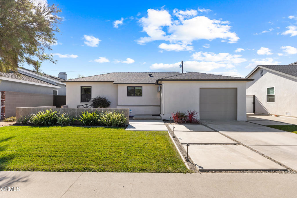 Welcome to 1881 Tulane Avenue, a stunning blend of modern design and classic comfort in the heart of Long Beach's highly desirable Los Altos neighborhood. This beautifully updated 3 bedroom, 2 bath home sits on a tree-lined street, exuding warmth, style, and functionality at every turn. The front landscaping and inviting patio create an ideal space for morning coffee or evening gatherings. Inside, you'll find a sleek minimalist aesthetic highlighted by rich hardwood finishes, polished concrete floors, dramatic beamed ceilings, large living room fireplace and an abundance of natural light that fills each room. The spacious bedrooms offer flexibility and comfort, while the primary suite impresses with soaring 10-foot ceilings, a custom walk-in closet, and a luxurious spa-inspired bath. The private backyard is perfect for entertaining or unwinding, featuring a mix of lush grass lawn, hardscape patio areas, and room to play or dine under the stars. Additional upgrades include new garage door, fresh exterior and interior paint, central AC/heat, custom blinds, inside laundry, and modern irrigation system. Conveniently located near CSULB, top-rated schools, local beaches, shopping and dining, this exceptional home truly captures the essence of contemporary Southern California living.