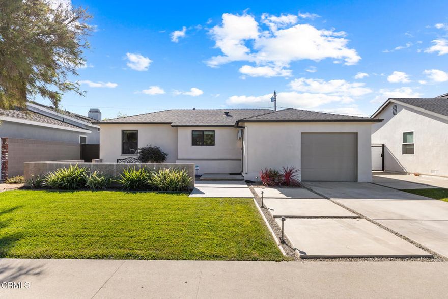 Welcome to 1881 Tulane Avenue, a stunning blend of modern design and classic comfort in the heart of Long Beach's highly desirable Los Altos neighborhood. This beautifully updated 3 bedroom, 2 bath home sits on a tree-lined street, exuding warmth, style, and functionality at every turn. The front landscaping and inviting patio create an ideal space for morning coffee or evening gatherings. Inside, you'll find a sleek minimalist aesthetic highlighted by rich hardwood finishes, polished concrete floors, dramatic beamed ceilings, large living room fireplace and an abundance of natural light that fills each room. The spacious bedrooms offer flexibility and comfort, while the primary suite impresses with soaring 10-foot ceilings, a custom walk-in closet, and a luxurious spa-inspired bath. The private backyard is perfect for entertaining or unwinding, featuring a mix of lush grass lawn, hardscape patio areas, and room to play or dine under the stars. Additional upgrades include new garage door, fresh exterior and interior paint, central AC/heat, custom blinds, inside laundry, and modern irrigation system. Conveniently located near CSULB, top-rated schools, local beaches, shopping and dining, this exceptional home truly captures the essence of contemporary Southern California living.