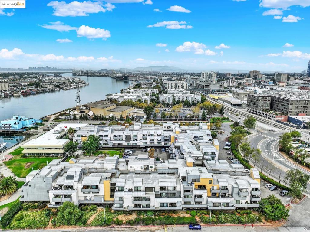 WOW! Move in Ready. Jack London Square Area. Near Amtrak station Featuring: 1 Bedroom Previously Updated Interior. Kitchen has Granite ounters, Stainless Steel Sink, Electric Stove/Cooktop, Open Counter to Living Room - Views.