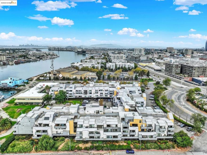 WOW! Move in Ready. Jack London Square Area. Near Amtrak station Featuring: 1 Bedroom Previously Updated Interior. Kitchen has Granite ounters, Stainless Steel Sink, Electric Stove/Cooktop,  Open Counter to Living Room - Views.