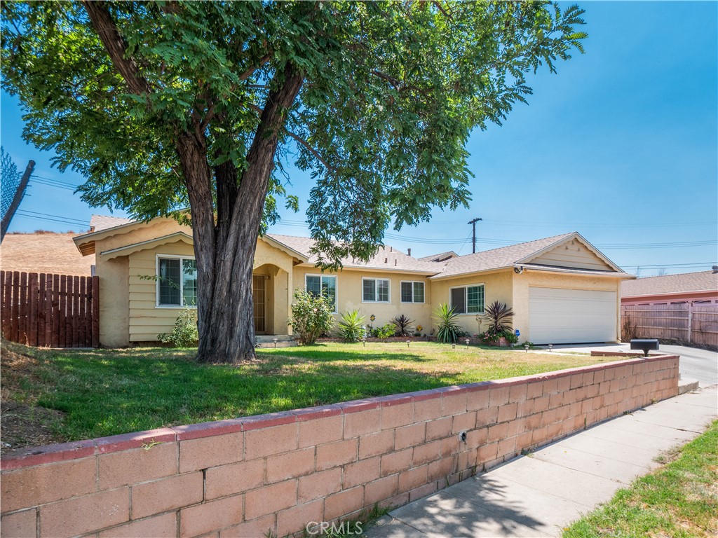 Welcome to 12326 Glamis Street, a beautifully updated single-story home featuring 4 bedrooms and 3 bathrooms on a spacious lot in Pacoima. Inside, the open floor plan offers a bright living area with a striking stone fireplace and plenty of natural light from new dual-pane windows and sliding glass doors. The kitchen has been completely remodeled with quartz countertops, stainless steel appliances, and modern cabinetry, flowing seamlessly into the dining and living spaces.
Enjoy stylish upgrades throughout including luxury vinyl plank flooring and recessed lighting. The layout includes a private primary suite with its own bathroom, plus a second en-suite bedroom—perfect for guests or extended family.
Additional improvements include a new roof, copper plumbing, tankless water heater, new home insulation, updated 200-amp electrical panel, and solar panels to be paid at closing. The low-maintenance backyard with artificial turf and patio space is ideal for relaxing or entertaining.
Ideally located near schools, shopping, and freeways, this home is also close to Hansen Dam Golf Course, Hansen Dam Park, and the Discovery Cube. This move-in-ready home is a must-see.