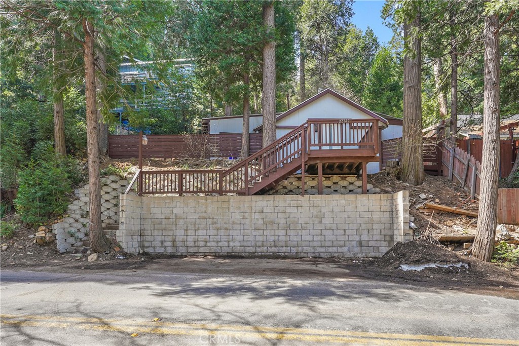 Beautiful Modern Cabin with private LEVEL PARKING just minutes away from LAKE GREGORY and located in the desirable city of Crestline! This home consists of 1 Bedroom, 1 Bathrooms, and a large living room with high ceilings. All new kitchen cabinets with QUARTZ countertops. The Kitchen comes with a brand-new Refrigerator, Gas Stove and Oven, Microwave and even Dishwasher! Whether you are looking for a getaway home or looking to live here full time this home is less than a short 20-minute drive down the mountain! A must see to truly appreciate. Some photos have been electronically staged. Schedule your private showing today!