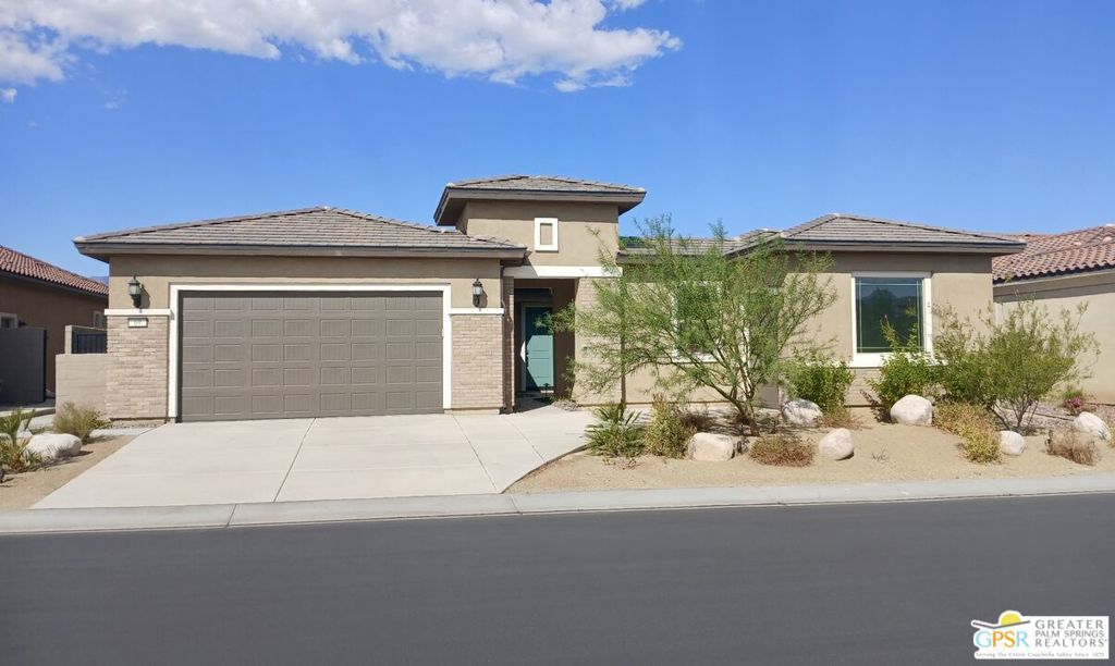 Experience Elevated Living in Rancho Mirage's Premier 55+ Community. Welcome to a beautifully designed single-story home in one of Rancho Mirage's most sought-after 55+ communities, built by the acclaimed Del Webb. This residence offers a perfect blend of comfort, style, and functionality in a setting that feels like a year-round resort. This spacious 3-bedroom, 2.5-bath home features an open-concept layout with vaulted ceilings and abundant natural light, creating an airy, inviting atmosphere. The gourmet kitchen is ideal for cooking and entertaining with a generous walk-in pantry and large island. Wall-to-wall sliding doors connect the main living area to a covered patio offering stunning views of the mountains, perfect for gatherings or peaceful mornings outdoors. Enjoy eco-friendly living with fully owned solar panels. Living in this exclusive 55+ community means access to top-tier amenities: a beautifully appointed clubhouse, social events, and activities designed to keep you active and connected. Play tennis, pickleball, or bocce on well-maintained courts, swim laps in the Olympic-sized pool, or simply relax in the tranquil, resort-like surroundings. Located just minutes from shopping, dining, and world-class golf, this home puts everything you need right at your fingertips. Whether you're looking for an active lifestyle or a peaceful retreat, this home delivers it all. Don't miss the chance to own a stunning home in one of the desert's most prestigious active adult communities. Schedule your private tour today and step into the life you've been dreaming of.