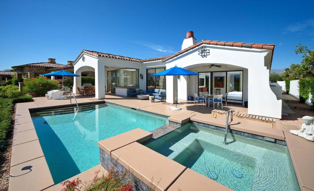 Nestled inside the prestigious Toscana Country Club, this beautifully remodeled home offers breathtaking views from its prime position on the 2nd hole of the Jack Nicklaus Signature South Course. Thoughtfully upgraded in March 2020 with approximately $250,000 in enhancements, this residence seamlessly blends timeless elegance with modern luxury.Follow the charming brick walkways through a cozy courtyard into a spacious great room featuring stunning stone flooring and custom built-in shelving. The gourmet kitchen is a chef's dream, showcasing gorgeous granite countertops and top-of-the-line Miele appliances--including a dishwasher, washer, dryer, and wine cooler. The master suite serves as a serene retreat, complete with a spa-inspired bath and large soaking tub. Two guest bedrooms, each with en-suite baths, and a private casita offer privacy and comfort for family and visitors alike. Major upgrades include an all-new A/C system, tankless water heater, updated walls and floors, custom shutters, a new entrance door, and a state-of-the-art alarm system. Outdoors, the resort-style living continues with a sparkling pool and spa, built-in BBQ, natural gas fire pit, new exterior sconces and lighting, and refreshed landscaping with upgraded irrigation. The patio and pool deck have also been resurfaced and repainted for a clean, modern finish. This exceptional home is move-in ready and perfectly positioned for refined desert living with sweeping fairway views.