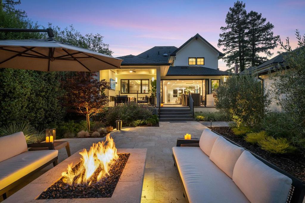 Newly Built. Fully Custom. Absolutely One-of-a-Kind. 424 Occidental is a breathtaking custom estate, rebuilt from the ground up in 2022 to deliver unparalleled luxury & resort-style living in the most prestigious neighborhood on the Peninsula. Behind private gates, this architectural showpiece seamlessly blends modern elegance & cutting-edge function. With 4 bedrooms, 3 full baths, & 2 half baths, the home features meticulous finishes & curated craftsmanship throughout. The chefs kitchen stuns w/ dual islands, custom cabinetry, Miele appliances, & centrally placed wet bar, perfectly designed for entertaining. Walls of glass open to an unmatched outdoor retreat, complete w/ sparkling pool & spa, outdoor lounge w/ built-in fireplace & TV, BBQ island, & fully equipped gym. A poolside changing room w/ full bath & outdoor shower completes the resort-style experience. The luxe primary suite includes a private deck, spa-inspired bath, & designer walk-in closet. Additional features: solar, tankless water heater, EV charger, & dual high-efficiency heat pumps. Plans available for a 4-bedroom upper level & fully entitled ADU. Unbeatable location offering the BEST walkability, just steps to downtown Burlingame. This home is a once-in-a-lifetime opportunity to own the Parks finest residence.