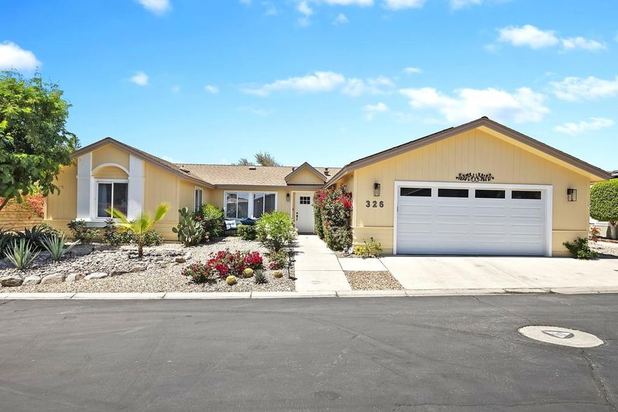 Welcome to the CROWN JEWEL of Suncrest Country Club! A stunningly renovated 3-bedroom, 3-bath home offering not one, but two master suites, and an amazing open-concept floorplan. Residing on one of the most private lots in the community with clear mountain views, just steps from club amenities, this home is an entertainer's dream and a serene retreat all in one. The charming frontage and immaculate desert friendly landscaping, with new irrigation system, welcomes you into a peaceful front courtyard with a charming seating area and tranquil fountain feature. Step into the gorgeous light-filled living room with vaulted ceilings, a spacious entertainment area, and a custom ultramodern electric fireplace wall. The newly designed kitchen boasts quartz countertops throughout, a long peninsula with a waterfall edge, breakfast bar and an abundance of additional cabinetry. Stainless-steel appliances, butler station, all new fixtures and a walk-in pantry further enrich this amazing kitchen with breakfast nook. The luxurious master suites, each with their own spacious walk-in closets, are complimented by exquisitely modernized bathrooms, tastefully furnished throughout. The indoor laundry room with wash sink provides direct access to a full 2-car garage with a recently upgraded opener and panel door. The private backyard oasis presents a spacious aluminum covered rear patio for entertaining, adjacent to a lavish artificial lawn area perfect for lounging or relaxing in the premium above-ground spa. A leased solar-system adds energy-efficiency to this incredible home, and the new A/C unit brings an ice-cold environment at the touch of a button. This entire home has been stylishly painted both inside and out. In addition to this beautiful property, Suncrest offers an abundance of amenities from a Clubhouse with a restaurant, to a 9-hole golf course, three community pools and spas (one only four houses away), pickleball and tennis courts, all within securitized gates. An incredible lifestyle upgrade, for an amazingly affordable price, minutes from shopping centers, fine dining, and all the Coachella Valley has to offer.
