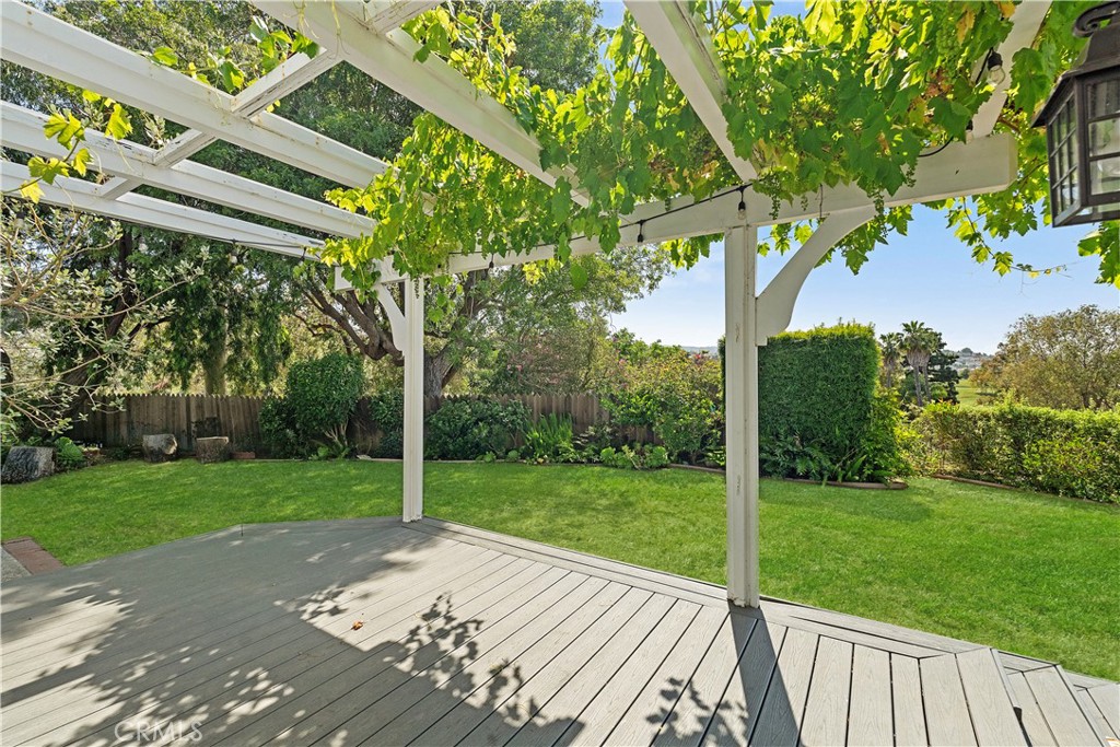 Welcome to your private sanctuary in Rolling Hills Estates — a rare opportunity to own a spacious 5-bedroom, 4-bathroom retreat with 3,482 square feet of living space, set on an expansive 18,569 square foot lot. Originally built in 1960 and beautifully reimagined in 1991 with a second-story addition, this home gives you timeless character with the space and setting to create something truly extraordinary.
As you arrive, you’ll follow a gated driveway that leads to a completely hidden, peaceful oasis — invisible from the street and surrounded by terraced gardens, fruit trees, two patios, and two separate yard areas. Whether you’re soaking in the dedicated Jacuzzi area or enjoying a quiet morning coffee outside, you’ll feel like you’ve escaped to your own private retreat. You can renovate a home in a few months — but it takes years for fruit trees to thrive. Here, that time has already been invested, and the results are yours to enjoy.
Inside, natural light pours through large windows, illuminating the warm hardwood floors throughout. You’ll love the spacious layout, which gives you two separate living areas, a formal dining room, and a versatile bedroom on the main level — perfect for guests, in-laws, or a home office. The kitchen features a custom Sub-Zero refrigerator and is perfectly positioned for daily living and entertaining, with ample space to cook, gather, and enjoy the natural flow of the home.
Upstairs, your primary suite becomes a true escape, offering sweeping views of the city skyline and Rolling Hills Country Club, along with a soaking tub that lets you relax while taking in the scenery.
With generously sized bedrooms, flexible indoor and outdoor spaces, and total privacy, this home is perfect whether you’re hosting friends or simply enjoying quiet evenings under the stars.
Living here, you’ll have access to one of the most beautiful and prestigious communities in Los Angeles County. You’re just minutes from the Jack Kramer Tennis Club, Rolling Hills Country Club, equestrian trails, parks, and scenic walking paths — all while enjoying easy freeway access for quick trips to the Westside, South Bay, or anywhere in L.A.
This is more than just a home — it’s a property with incredible bones, endless potential, and the kind of privacy and views that are almost impossible to find. Now is your chance to make it your own.