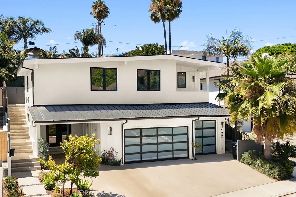 122 W Avenida De Los Lobos Marinos is a rare coastal opportunity, fully redesigned and rebuilt in 2024 by CH Anderson. Unmatched in Southwest San Clemente, the property showcases an expansive 3.5 car garage, an additional carport, and a three car wide driveway apron, providing exceptional convenience for golf carts, e-bikes, and your entire coastal fleet. Inside, open living spaces flow effortlessly into a chef’s kitchen appointed with custom cabinetry, premium appliances, and striking finishes. Disappearing glass doors erase boundaries between indoors and out, extending the living space onto sunlit patios and capturing the quintessential Southern California lifestyle. Refined bedrooms, each with their own spa inspired bath, offer private retreats that balance sophistication with comfort. Every detail reflects thoughtful design and superior craftsmanship, while the location places you moments from the sand, boutique dining, and the vibrant coastal energy of San Clemente. From surfing and mountain biking to pickleball and sunsets over the Pacific, this home is more than a residence, it is a modern expression of the beach lifestyle at its finest.