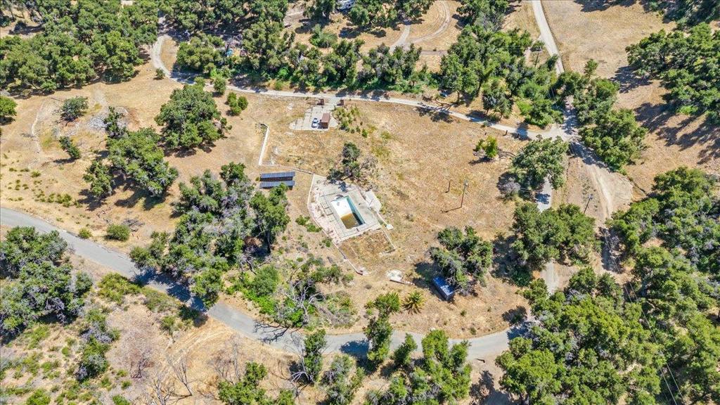 Land of opportunity. This parcel located at 7 Trampa Canyon bolsters over 15 acres of land. The property contains three wells exclusive to the property and unshared. The area for the home rebuild contains an olympic sized pool. This parcel contains 42 fully owned solar panels with two inverters generating up to 18,000 kilowatt hours a year. The property contains 3 Canary Palm trees adding more value. This property is designated for agricultural and communal use. The current owners obtained USDA Farm designation. Additionally, the property contains two 20' Conex shipping containers. One container holds a John Deere tractor and Frontier rotary cutter. The other container holds a 6 person crossover utility vehicle. This opportunity is ready for the next chapter that will add value and habitability.
