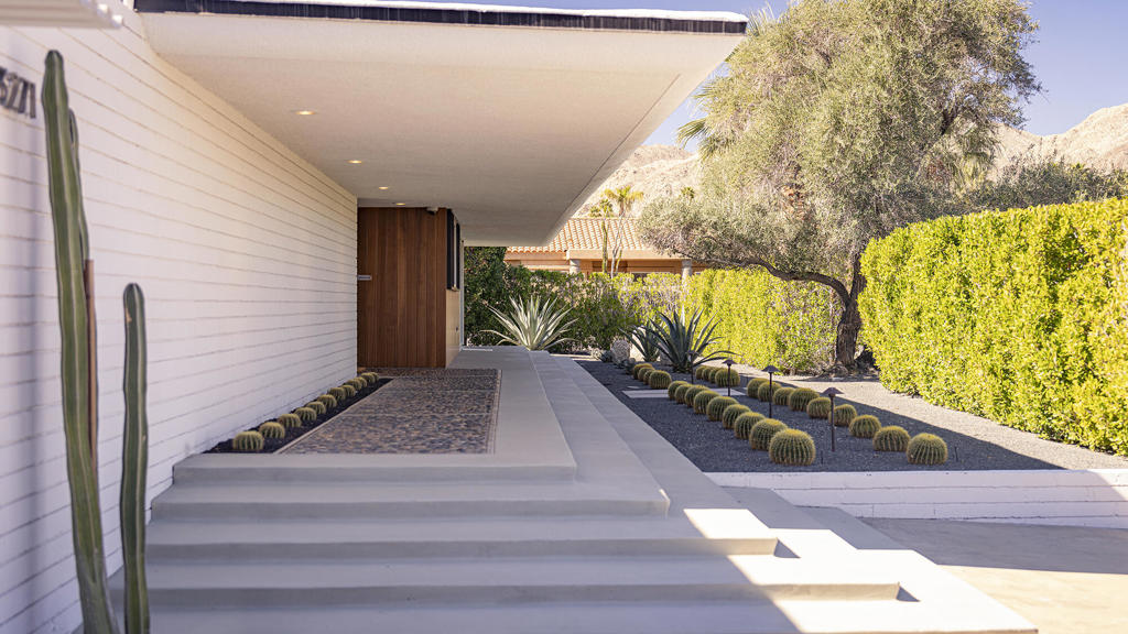 Paulette Johnson HausExperience timeless mid-century modern living in the heart of Palm Desert.Designed by renowned architect Walter S. White, this historic home exemplifies clean lines, floor-to-ceiling glass, and effortless indoor-outdoor flow -- the essence of desert modernism.This residence is fully furnished with custom designer interiors by Garrett and Garage. The chef's kitchen features high-end appliances, sleek cabinetry, and an open layout perfect for entertaining. Two spacious bedrooms and two elegant baths offer comfort and privacy, while expansive glass walls frame dramatic mountain views, palm trees, and tranquil water features.The grounds are equally impressive:- Private pool and hot tub with shaded lounging areas- Covered cabana for outdoor dining- Bocce ball court and putting green for leisurely afternoons - Multiple fire pits for warm desert evenings under the starsLocated just minutes from El Paseo's world-class shopping and dining and only steps from The Living Desert and hiking trails, this home blends architectural pedigree with modern luxury -- an ideal retreat for discerning tenants seeking privacy, style, and convenience.