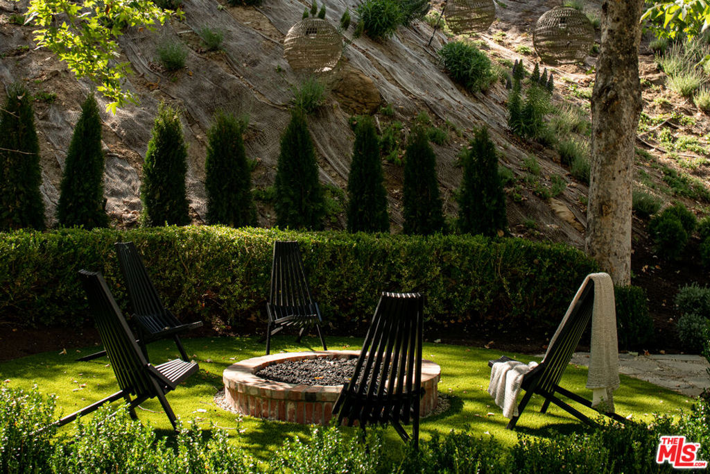 Welcome to this contemporary storybook traditional offering unparalleled privacy and security.