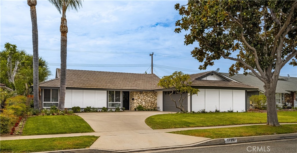 Welcome Home to Placentia!
You’ll fall in love with this beautifully updated single-story residence tucked away on a picturesque, tree-lined street where pride of ownership shines.
Step inside and be greeted by a light-filled spacious living room with a charming rock gas fireplace. The dining area, with its expansive windows and fresh updates, offers the perfect setting for both everyday meals and large gatherings.
The open kitchen features newer stainless steel appliances, crisp white cabinetry, updated hardware, and convenient island access—making it a true hub for entertaining and daily living.
The primary suite is a relaxing retreat complete with a new ceiling fan, plantation shutters, mirrored closet doors, and a renovated en-suite bath featuring a walk-in shower. Three additional bedrooms provide flexibility for family, guests, or a home office, all with easy access to the full hall bath.
A dedicated interior laundry room with space for a full-sized washer and dryer adds everyday convenience.
Outside, enjoy your own private oasis with an expansive slab patio, refreshed landscaping, mature trees, a generous side yard, and grassy areas perfect for play, relaxation, or entertaining.
Upgrades include: fresh interior and exterior paint, newer HVAC and thermostat, updated lighting and fans throughout, new stainless steel oven and newer cooktop/dishwasher, laminate flooring, refreshed bathrooms with new fixtures, shower door, and cabinetry, plus upgraded blinds and hardware.
Ideally located near top-rated Placentia schools, parks, Cal State Fullerton, and with easy freeway access, this home truly combines modern comfort with everyday convenience.