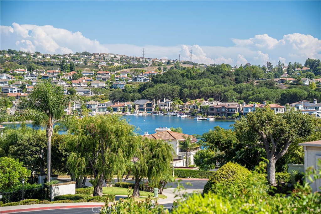 A LITTLE SLICE OF HEAVEN.... This home has one of the nicest views of any non-waterfront, garden level unit in the entire complex. As you sit out on the large rear patio, enjoy panoramic views stretching from Saddleback Mountain to the North and expanding to Lake Mission Viejo, hills, city lights, greenbelts and neighborhoods to the North, East and South. You will experience spectacular sun rises and magnificent moon rises. Attention to detail is obvious from top to bottom with textured ceilings, crown molding, ceiling fans and recessed lighting on top and oversized baseboards and new flooring on the bottom. In between there is fresh paint, wide blade plantation shutters, new fireplace, kitchen appliances, new sinks/toilets/faucets, mirrored closet doors, closet built ins, showers with glass enclosures, cabinets with dovetail joint construction and soft close features, quartz countertops/backsplash, bathroom doors with opaque glass for privacy and vinyl windows/sliding doors. The 2 car detached garage is the closest possible and Soller has some of the best guest parking in Mallorca. Speaking of Mallorca, experience & enjoy the lifestyle! Private beach with restrooms/picnic tables/BBQ’s/designated swimming area/72 in-the-water boat docks/shower/racks for paddle boards, 2 pool/spa areas w/restrooms, a walking path along the greenbelt, a boat loading dock and a fishing dock, an extensive lakefront walking promenade and a 24/7 manned gate. Naturally Lake Membership is part of the package. Lake Membership creates the opportunity for boat rentals, the use of the North & East Beach facilities, attending the Summer Sunset Concerts and watching the lake fireworks display at the conclusion of the last concert, designated swimming, occasional fishing, the annual taste of the lake, sand volleyball, the use of club houses and viewing of summer movies. The city of Mission Viejo itself is an attraction. Shopping at the Mission Viejo Mall is an experience. If you enjoy High School Football, Mission Viejo High is nationally ranked annually. Mission Hospital is the Trauma Center for South County. There are parks everywhere and the naturally wonderful Oso Creek Trail is almost a secret. Centrally located between Los Angeles and San Diego, the city is also less than 30 minutes from international destination beach cities like Laguna, San Clemente, Corona del Mar, Huntington, Newport and Dana Point. Catching a flight from John Wayne Airport (SNA) is a 20 minute ride. Why wait?