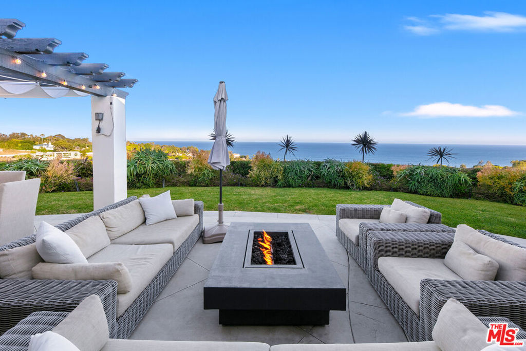 One-Story Estate with uninterrupted 180-degree Ocean Views from Palos Verde to Point Dume. This contemporary Malibu Oasis is in the private neighborhood of Sycamore Park. Reimagined by Burdge & Associates, featuring indoor/outdoor flow perfect for entertaining under the stars or soaking up the sun in quiet solitude. The house exudes a laid-back yet luxurious coastal vibe with sun-washed tones and seamless open-concept living spaces. Gated courtyard, chef's kitchen with Ann Sacks tiles, 3 ocean view bedrooms including a luxurious master suite with fireplace, sitting area, steam shower, soaking tub & patio with Sundance Spa. Featuring wrap around decks, 2 fireplaces, pergola, BBQ island, trellis with hanging beds, new 6 seat golf cart, private neighborhood access to Escondido Beach. Generac back up power generator, private tennis club/membership available, outdoor shower, 2 Life Source water purification systems & bonus office/ bedroom. Lush landscaping, hidden corners, and multiple lounge areas provide a balance of openness and privacy. Whether you're watching dolphins play or curled up beside a firepit, this Malibu sanctuary is a true retreat. Serenity awaits this one of a kind property.