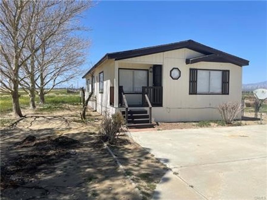 Charming 2 bed, 2 bath home with bonus room on 2.25 acres in West Rosamond! Set on a permanent foundation, this property offers open space and privacy while still being close to town and the 14 Freeway. Enjoy wide open skies, desert sunsets, and room for RVs, animals, or future projects. Features include split AC/heat, fenced yard with shed, and shared well. The bonus room makes a perfect office, guest space, or hobby room. A great opportunity to enjoy rural living with convenience nearby!