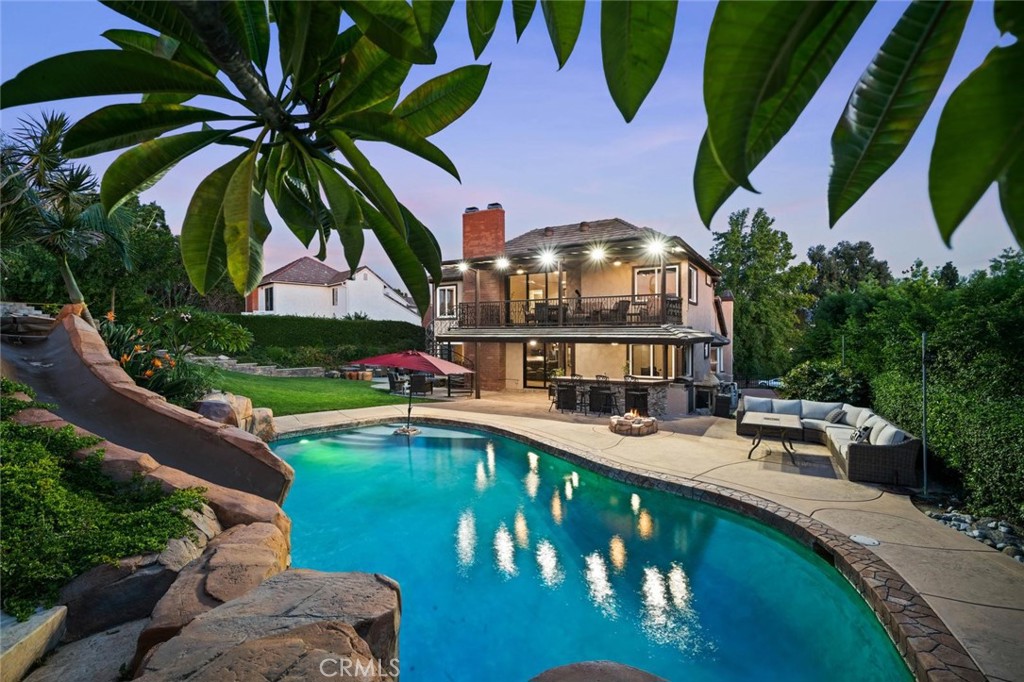 Seller willing to carry at a rate of 5.5% with flexible terms including lease to purchase! Estate Family Home, No HOA, or Mello Roos, Spacious pie shaped lot, quiet
& serene away from the busy city. 180’ Panoramic City Light views, Catalina Island views , Disneyland Fireworks, Angel Stadium, Signal Hill, & surrounding rolling
hills Massive 13k+sqft lot with amazing 8 bedrooms & 5 bathrooms a rare find! Welcoming open airy feel with lots of natural lighting, wood beamed vaulted
ceilings as you enter the 8 foot double steel doors. Sunken separate Family room with private fireplace off to left & JADU (permits in process); off to the right, 1
bedroom with walk in closet. Custom upgraded 1 bath, full kitchen & separate living area downstairs. Perfect for multigenerational living with large families, or
rent out for extra income. As you move 1/2 flight upstairs your greeted with a Luxury NEW Chef kitchen including Mable Granite Countertops a Double oven, large
4 door refrigerator, real wood cabinets & new black stainless-steel appliances & garden window, opens up to living room with private fireplace, ceiling fans, large windows with lots of natural lighting, sliding glass wall doors opens up to backyard & outside covered patio with large BBQ station & custom Rock Pool. Custom
Rock waterfall, 16 ft slide, multicolored lights , (20x 40 feet pool 50k gallons) heated by gas, & a gas fire pit. Additional large 7 person 50+ jet Cal Spa. Master
suite includes vaulted ceilings, cozy fireplace, retreat area & lots of naturals lighting, private master bath suite with 2 person soaker spa tub for long hot baths,
separate custom shower, 2 person granite counter sinks & large covered balcony with sliding glass walls with spiral staircase. 2nd Master bedroom near kitchen
has its own private bath jet spa & shower combo, All Bathrooms upgraded with new granite countertops & cabinets. 3 upgraded Fireplaces with modern
granite/rock/ mantle combination. 14 Ceiling fans throughout with lots of natural light. 33 owned Solar panels & micro inverters with monitoring through solar
edge, 220 charge station for electric cars. Large custom 2 level work-shed, separate boat/RV parking on side yard with no neighbors directly behind fence line. 700
feet elevation lots of mountain views surrounding the area, misty morning clouds come often, as different types of free-range animals come to the borders of the
fence line through the week, a natures paradise, with stunning sunsets.