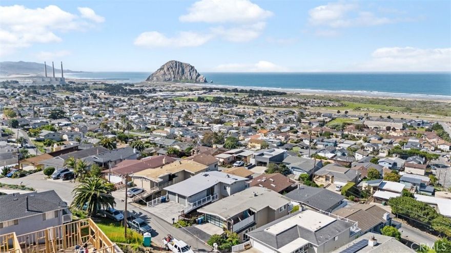 Enjoy sweeping views from Point Estero to Point Buchon—including iconic Morro Rock, the harbor entrance, tranquil back bay, and endless stretches of whitewater ocean. This beautifully maintained 3-bedroom, 2.5-bathroom home offers approximately 1,600 sq. ft. of coastal living at its finest. Step inside to find a remodeled kitchen, a newer membrane roof, and brand-new composite decking with reinforced structural supports—perfect for soaking in sunsets and sea breezes. The main level includes direct access from the two-car garage, along with the primary suite, a cozy fireplace-warmed living room, dining area, and kitchen—ideal for single-level living. Downstairs, you'll find two additional bedrooms, 1.5 bathrooms, a laundry room, and a spacious bonus room with exterior access—perfect for a media room, home office, or guest space. Lovingly cared for and move-in ready, this home is your chance to embrace the beauty, peace, and charm of Morro Bay living.