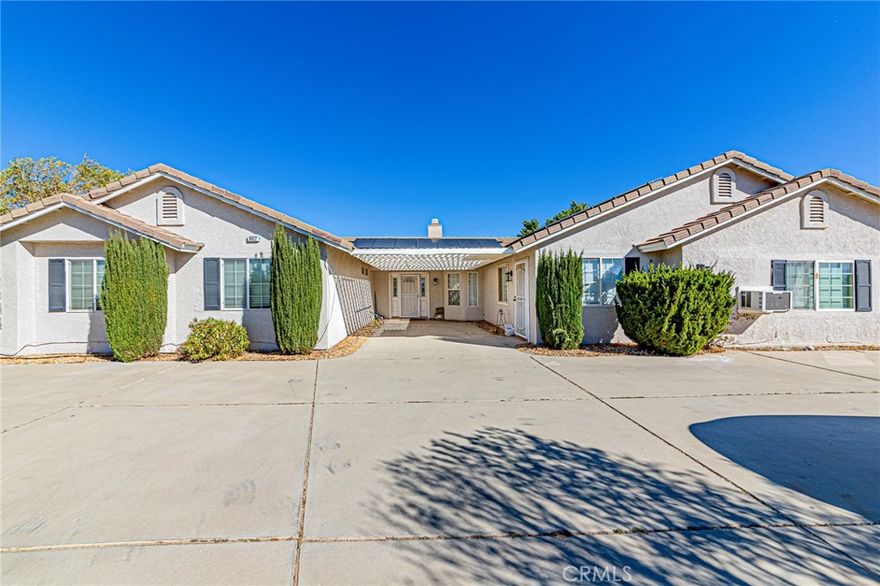 Location! Location! Location!

This beautiful home is perfectly situated on the West Side of Oak Hills, offering easy and convenient access to both the 15 and 395 Freeway -ideal for commuters and travelers alike.

Just within 1-3mile, a massive Amazon facility is currently under construction, bringing incredible growth potential and future value to the area. Whether you're looking for a smart investment or a peaceful place to call home, this property has it all. Enjoy the charm of country living with three well-built greenhouses and a variety of mature fruit trees—grow your own fresh vegetables and fruits year-round!

A fully paid-off solar system means you can say goodbye to high electricity bills. Additional features include an RV carport, a spacious storage, and wide concrete driveways in both the front and back of the home—offering comfort and functionality in every direction.

The property also includes a converted garage unit (662 sq ft) featuring 2 bedrooms, 1 bathroom, a kitchen, and a separate private entrance .generating extra income potential or providing the perfect space for guests or extended family.

Sitting on approximately 2 acres, the lot may have potential for commercial use in the future (buyer to verify), incredible opportunity.