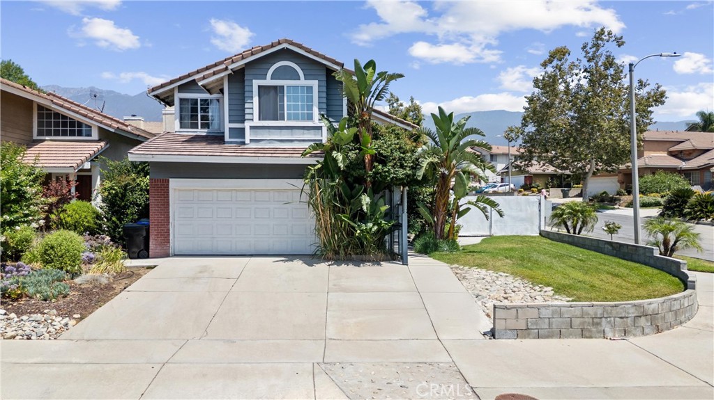 Welcome to this stunning two-story home located in a highly desirable area of North Rancho Cucamonga. Nestled in a beautiful neighborhood known for its top-rated schools—including the sought-after Los Osos High School—this home offers an unbeatable combination of comfort, style, and convenience. All schools are within walking distance, making it an ideal location for families.
Step inside to high vaulted ceilings and an open-concept floor plan that creates a bright, airy atmosphere. The recently remodeled kitchen is a true showpiece, featuring granite countertops, a decorative tile backsplash, an island with barstool seating, and a seamless flow into the living and dining areas. The living room is centered around a beautifully updated fireplace, perfect for cozy evenings. Downstairs also includes a convenient half bath and laundry room.
Upstairs, you'll find all four bedrooms, including a spacious primary suite that opens to a huge private deck—an ideal spot to relax and take in the surroundings. The primary bathroom offers a dual sink vanity and a large walk-in closet, while a full guest bath serves the remaining bedrooms.
The backyard is an entertainer’s dream, featuring a covered patio, sparkling pool and jacuzzi, a tranquil koi pond with waterfall, and mature fruit trees.
Additional highlights include recessed lighting throughout, a finished garage with built-in cabinet storage, and proximity to shopping, dining, Chaffey College, and major freeways—ensuring everything you need is just minutes away.
This home is move-in ready and truly checks every box—schedule your private tour today!