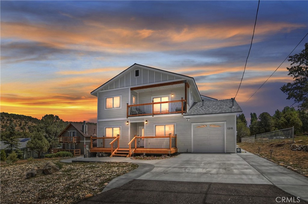 Elevate your lifestyle ~ Set yourself apart with this newly built 2023 custom mountain residence, where exceptional design, comfort, and breathtaking views come together in perfect harmony ~ Ideally located just 15 minutes from all of Big Bear’s year-round amenities ~ This spacious home offers the perfect balance of seclusion and accessibility ~ Step inside to be greeted by soaring high ceilings and an open floor plan bathed in natural light ~ The inviting interior features high-end finishes throughout, including custom natural quartzite countertops, sleek stainless steel appliances, hand painted solid wood base boards and thoughtful touches that elevate everyday living ~ The expansive great room seamlessly connects to the kitchen and dining area, creating an ideal flow for entertaining or unwinding in style ~ The home’s exterior is just as impressive, enjoy sunrise coffee or sunset cocktails from the large front and back decks, or take in the crisp mountain air from the private upstairs balcony off the game room ~ Whether you're relaxing or hosting guests, every corner of this home was designed to capture the surrounding mountain beauty ~ An attached garage and additional storage shed provide ample space for all your mountain toys from snowboards to climbing equipment, as well boat and jeep parking ~ The adjacent lot can potentially be included in the sale at the right price, the possibilities to expand or simply enjoy extra space and privacy are yours to explore ~ Whether you're seeking a primary residence or a luxurious second home this one-of-a-kind property delivers both elegance and opportunity ~ Experience the finest of mountain living in this custom-built move-in ready home ~ its waiting for you to create endless memories with your family and friends.
