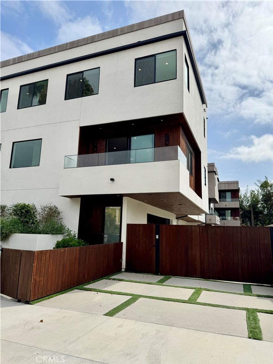 Modern 3-Bedroom House with Rooftop Deck & Designer Finishes | Built in 2023



Welcome to this stunning, newly built (2023) tri-level home offering 3 bedrooms, 2.5 bathrooms, and 1,809 sq ft of beautifully designed living space. Located in a prime area with easy access to the 405 and 134 freeways, you're just minutes from Beverly Hills, West Hollywood, and some of L.A.’s best shopping, dining, and entertainment.



Step inside to a bright and open second-floor living area featuring a spacious open-concept layout, perfect for entertaining. The fully upgraded kitchen boasts a luxurious quartz waterfall island, high-end appliances include Thermador Stove / Range, Cooktop, Wall oven, Refrigerator, Dishwasher and sleek modern cabinetry. A sliding glass door leads to a private deck—ideal for morning coffee or evening wine.



Upstairs, you'll find a generous master suite with a walk-in closet and a beautifully finished ensuite bath, along with two well-sized guest bedrooms and a convenient laundry room.



And the showstopper? A private rooftop deck offering expansive views—perfect for outdoor dining, entertaining guests, or simply enjoying the Southern California lifestyle.



Additional features include:



Attached 2-car garage



High ceilings and large windows for abundant natural light



Premium flooring and finishes throughout



Energy-efficient design



This home truly combines style, comfort, and location in one incredible package. Whether you're a family or a professional couple, you’ll love living in this modern masterpiece.