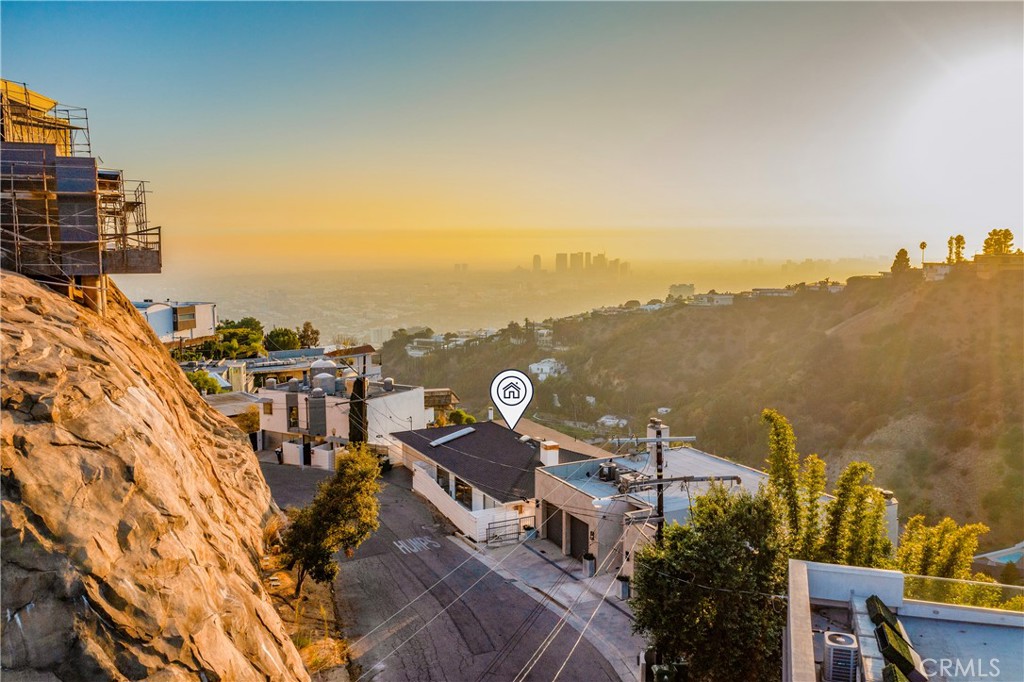 VIEWS, VIEWS, VIEW! SELLER WANTS OFFERS. Calling all developers or people that want to make this amazing view property their own! Development opportunity with upside protentional or move right in. One of the best views in the Hollywood Hills! Southwest facing, explosive jetliner views from the city lights all the way to the ocean. Swanky, stylish and modern home brings the “wow factor.” Huge windows in the dramatic two-story living room offer unlimited sunlight and amazing sunsets. Multiple balconies and patios provide for the California indoor-outdoor experience. Live the Hollywood Hills lifestyle. HUGE LOT with over 15,000 sqft.. This site has endless possibilities and potential. Seller bought another and wants this one sold!!