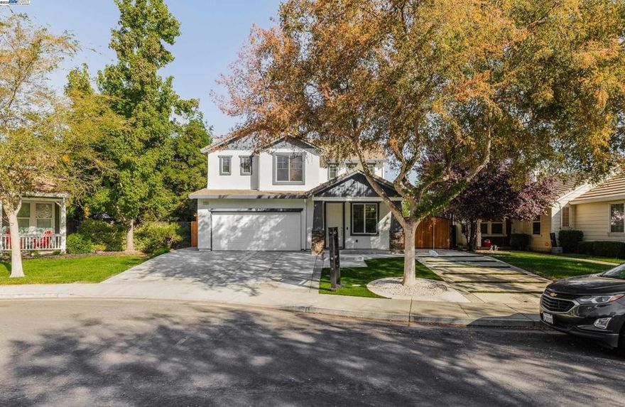 2753 Merchant Ct blends comfort, style, and functionality. This 5-bed, 3-bath home (with a bedroom and bath downstairs) was designed for modern living - open spaces, natural light, and thoughtful upgrades throughout. A professionally extended driveway with gated access to the backyard offers room for RV, boat, or extra vehicles. Step inside to new luxury vinyl floors, fresh paint, recessed lighting, and a smart thermostat. The chef’s kitchen shines with granite counters and stainless appliances. Upstairs, a serene primary suite with soaking tub and walk-in closet provides the perfect retreat. Outside, enjoy no rear neighbors, low-maintenance landscaping, and a private setting minutes from Kimball High, shopping, parks, and I-205.