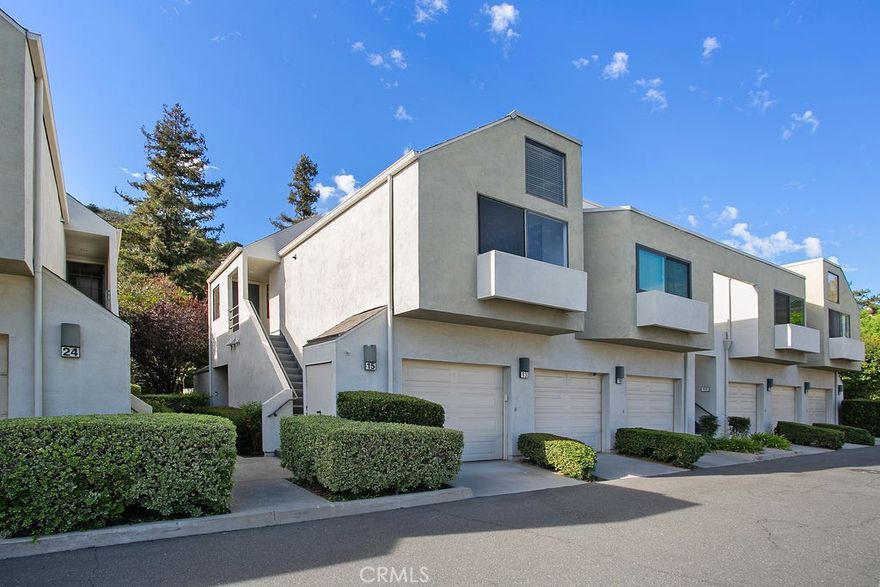 Welcome to your own private retreat in the highly desirable Villeurbanne Community of Orange! This charming one-bedroom, one-bath condo is perfectly situated in one of the community's most sought-after locations, surrounded by lush trees and greenbelts. Step inside to find a bright and open layout featuring dramatic vaulted ceilings, oversized skylights that flood the home with natural light, and a cozy fireplace as the centerpiece to the living room. The spacious dining area offers bar-top seating to the kitchen. A private balcony extends your living space outdoors, ideal for al fresco dining or simply relaxing with the peaceful greenery. The generously sized bedroom is bathed with natural light and features ample closet space. Additional highlights include an inside laundry closet with full-size washer and dryer. Residents of Villeurbanne enjoy resort-style amenities including sparkling pools, relaxing spas, BBQ areas, and access to a private reservable community center. Outdoor enthusiasts will love the nearby walking paths, hiking trails, and close proximity to Peter's Canyon and Irvine Regional Park. Convenient freeway and toll road access makes commuting a breeze. This home is an incredible opportunity to enjoy peaceful living in the hills of Orange.