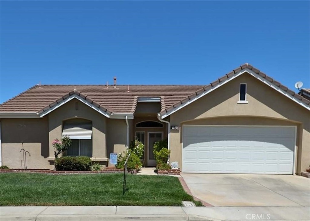 This beautifully kept 2-bedroom, 2-bathroom single-story home offers a functional layout and desirable features throughout. The open living and dining areas provide excellent flow, complemented by abundant natural light. The kitchen includes ample cabinetry and counter space, designed for both everyday living and entertaining. A dedicated indoor laundry area with washer and dryer adds convenience. The primary suite features an attached bathroom and walk-in closet while the secondary bedroom is well-sized for versatility. Additional highlights include a two-car garage, low-maintenance landscaping, and a private backyard with plenty of room to enjoy. Situated within the well-maintained gated community of Laurel Park, this home offers close proximity to local shopping and parks.