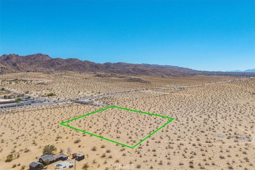 This parcel of land in Joshua Tree offers a wide-open canvas with expansive views stretching across the desert basin toward the rugged ridgelines of Joshua Tree National Park. The lot is flat and ready for future plans, whether that means building a primary residence, creating a private retreat, or developing a weekend escape. Electricity is close by, and a water meter may be available through Joshua Basin Water District (buyer to verify).



The location places you minutes from the National Park’s west entrance, a world-class destination for hiking, climbing, and stargazing. Downtown Joshua Tree is also within easy reach, where the weekly farmers market, art galleries, and local music events bring the community together. With its balance of quiet seclusion and access to area highlights, this property provides an opportunity to shape your own desert lifestyle.