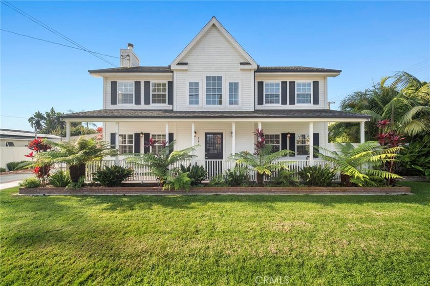 Nestled on a desirable corner lot in the heart of Eastside Costa Mesa, this Cape Cod–inspired residence offers timeless charm paired with thoughtful modern updates. The beautifully enhanced 3-bedroom, 2.5-bath home features approximately 2,151 square feet of warm, light-filled living space designed for comfort and style, all oriented toward effortless coastal indoor–outdoor living.Step inside through the inviting Dutch door to discover an open and welcoming layout that includes a generous living room, a separate family room, and a thoughtfully designed kitchen with marble countertops, stainless steel appliances, and a sunlit breakfast nook. Upstairs, both the primary and secondary bathrooms have been completely redesigned and reimagined with beautifully selected materials, elevating the home’s overall sense of luxury. The primary suite features vaulted ceilings and a well-appointed walk-in closet, complemented by two additional bedrooms. The expansive backyard is ideal for seamless entertaining, enhanced by multiple patio areas, low-maintenance turf, and an above-ground spa. Lush, mature landscaping—lovingly maintained and thoughtfully arranged—creates a tranquil, inviting setting that truly sets this property apart. Additional highlights include central AC, upstairs laundry, dual-pane windows, wood flooring, and a detached two-car garage with epoxy flooring. Located near award-winning schools, world-class beaches, and the vibrant shops and dining of 17th Street, this home blends comfort, convenience, and quintessential Eastside charm.