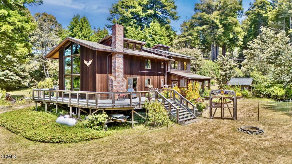 Poggi's Eagles Nest is just far enough from the ocean to hear the sounds of the sea, yet inland enough for sun and pleasant weather. This country-style home has many additional bonus rooms including an attached greenhouse/sunroom that is a favorite place for nature watching, a large entry family room to relax after a long day and an upstairs 'room of many possibilities' that is bright, sunny and spacious. The vintage-style country kitchen has a charming buttercup yellow farmhouse sink overlooking the flowering gardens. The connecting living room with brick hearth and dramatic 2 story picture windows capture views of nature from every direction. The permitted 1200 sq. foot garage/shop building has 220 power, solid slab floors and high ceilings. It is perfect for anyone who has dreamed of having space to spread out their projects with room to spare. An owned solar system keeps electric bills to a bare minimum and ensures power when inevitable outages occur. Comcast internet is available. Located in the desirable Inglenook area of north Fort Bragg. The quiet and privacy of Sutliff Lane are treasured qualities. Make an appointment to view this unique offering today.