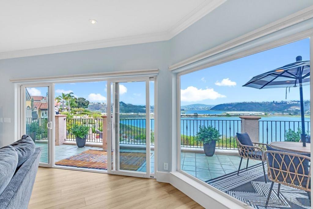 Extraordinary ocean, shoreline and lagoon views from this advantageously-perched FULLY FURNISHED custom home! The recently renovated kitchen and living areas offer stunning water views from almost every room. The reverse floor plan maximizes the beautiful surroundings and offers four bedrooms, an office, approximately 4,335 sf., and an elevator! Enjoy new flooring throughout the living areas and bedrooms, large picture windows, and multiple skylights that bring in natural light. This energy-efficient home has owned solar, low maintenance landscaping, a large patio, multiple decks, and an oversized two-car garage. The recently renovated kitchen in coastal hues, has a large waterfall edge island that eats eight, stainless Wolf appliances, Sub Zero refrigerator, hidden walk-in pantry, and beautiful wet bar. Ideally located west of the 5,beach close, and across from nature trails that lead to the beach and lagoon. Conveniently close to shopping and restaurants, and within the Carlsbad School District. The Rosalena community offers a pool, spa, and barbecue area. This incredible setting overlooking Ponto Beach and the Batiquitos Lagoon is a rare and truly special find! Owner pays for gas, electric , water and internet.