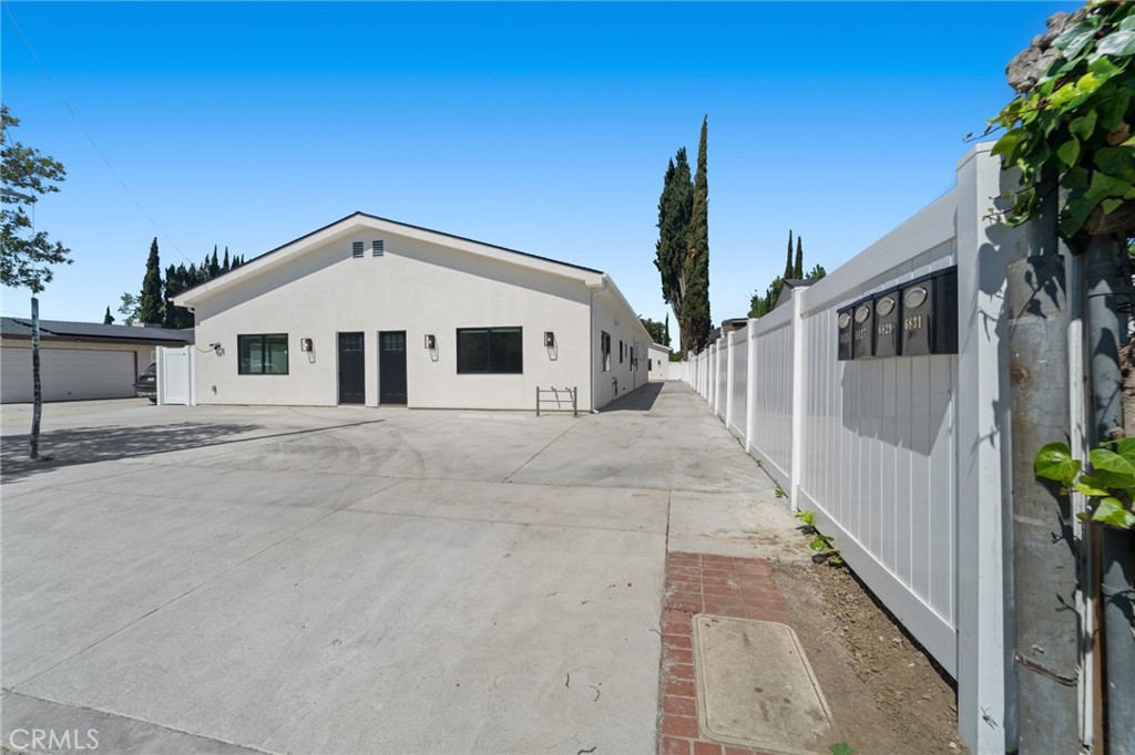 Fully loaded and delivered vacant, this exceptional property features a turnkey duplex and two brand-new ADUs—an incredible opportunity for investors or owner-users. Only a block away from Valley Glen, the single-story duplex offers two identical side-by-side units, each with 3 spacious bedrooms and 3 ensuite bathrooms, in-unit laundry, top-of-the-line LG appliances, and elegant Spanish porcelain tile throughout the main living areas. High ceilings and extensive kitchen cabinetry elevate the design, making each unit as functional as it is stylish. A long driveway leads to a spacious shared courtyard that connects the duplex to the newly constructed ADUs, which mirror the same premium finishes, include their own in unit laundry and Tesla solar panels for energy efficiency. With ample parking, modern amenities, and no tenants in place, this fully vacant, income-producing asset is ready for immediate occupancy or strong rental potential. Each unit has its own address- 6827, 6827, 6829 and 6831 Ranchito Ave.