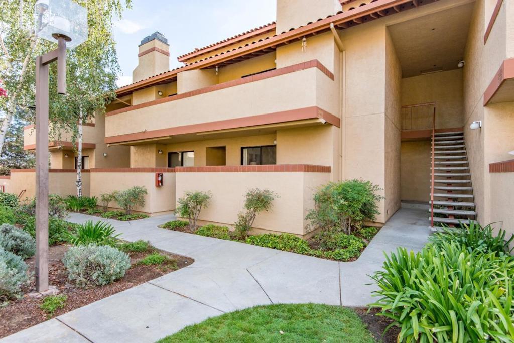 Welcome to this charming 1-bedroom, 1-bathroom condominium located in the vibrant city of Cupertino. 5-minute walk to the Apple Computer campus. Easy bike ride to De Anza Junior College. 1/2 block from the Homestead Square Shopping Center including Starbucks, Safeway & several restaurants. This cozy residence offers 871 square feet of living space. The kitchen is well-equipped with an electric oven range, dishwasher, and tile countertops, perfect for all your culinary needs. The dining area conveniently adjoins the living room, creating an open and inviting space. You will find carpet and vinyl/linoleum flooring throughout the home, providing a blend of comfort and practicality. The living room features a fireplace, adding warmth and ambiance to the space. For added convenience, a washer and dryer are included in the unit. The property also boasts an in-ground community pool, ideal for relaxation and leisure. With 1 garage space and plenty of guest spaces, parking is readily available. Don't miss the opportunity to own this delightful home in the heart of Cupertino. Easy access to Highways 85, 280, 101 and near all amenities.