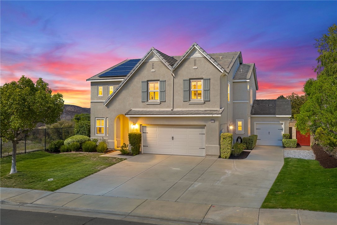 *VIEWS *HUGE CORNER LOT * OWNED SOLAR *MAIN FLOOR BEDROOM *VERY LOW HOA DUES *Welcome to Country Roads-one of Murrieta’s most charming communities! This beautiful 5-bed, 3-bath home offers 3,404 sq ft of living space on a large, private corner lot backing to open space w/ hill views. It feels like rural living yet is minutes from Spencer’s Crossing, new shopping, restaurants, & top-rated Murrieta schools. With its picture-perfect curb appeal & charming “dollhouse” exterior, this home is sure to impress from the moment you arrive. Enjoy a 3-car garage (2-car + separate 1-car) w/ plenty of driveway parking. Inside, you’re greeted by soaring 2-story ceilings, a bright living room w/ plantation shutters, & a formal dining room featuring custom molding & a stunning chandelier-perfect for hosting your upcoming Thanksgiving feast. The main floor includes a full bedroom & bath w/ updated lighting & tub/shower combo, ideal for guests. The family room offers a cozy floor-to-ceiling stone fireplace & custom built-ins, open to the kitchen w/ granite counters, subway tile backsplash, stainless appliances, island, & a huge walk-in pantry. A casual dining space nearby is perfect for family meals or entertaining friends. Upstairs, the primary suite features a double-door entry, private balcony to relax under the stars, dual sinks, large soaking tub, separate shower, & large walk-in closet. You’ll also find 3 spacious secondary bedrooms all with walk-in closets (2 w/ ceiling fans, 1 w/ dainty chandelier), a hall bath w/ dual sinks, & laundry room w/ sink, cabinets, & large linen closet. Step outside to your private retreat - enjoy serene views, a stamped concrete patio, freestanding firepit, & a generous side yard w/ fruit trees. Extra perks: OWNED SOLAR to save you $$ on your SCE bill, newer water heater, SMART thermostats, recessed LED lighting, & workbench in the 1-car garage. Conveniently located near Target, Costco, Home Depot & a lot more shops & restuarants, including the Promenade Mall in Temecula, & entertainment such as Murrieta Market Nights, the renowned Temecula wineries & Pechanga Casino. This home perfectly blends charm, comfort & convenience-make it your own in time for the holidays!