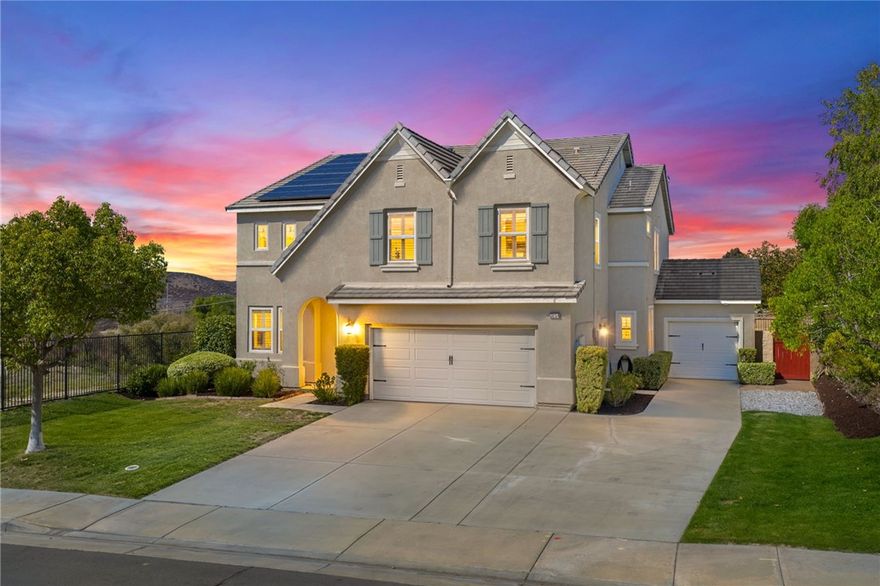 *VIEWS *HUGE CORNER LOT * OWNED SOLAR *MAIN FLOOR BEDROOM *VERY LOW HOA DUES *Welcome to Country Roads-one of Murrieta’s most charming communities! This beautiful 5-bed, 3-bath home offers 3,404 sq ft of living space on a large, private corner lot backing to open space w/ hill views. It feels like rural living yet is minutes from Spencer’s Crossing, new shopping, restaurants, & top-rated Murrieta schools. With its picture-perfect curb appeal & charming “dollhouse” exterior, this home is sure to impress from the moment you arrive. Enjoy a 3-car garage (2-car + separate 1-car) w/ plenty of driveway parking. Inside, you’re greeted by soaring 2-story ceilings, a bright living room w/ plantation shutters, & a formal dining room featuring custom molding & a stunning chandelier-perfect for hosting your upcoming Thanksgiving feast. The main floor includes a full bedroom & bath w/ updated lighting & tub/shower combo, ideal for guests. The family room offers a cozy floor-to-ceiling stone fireplace & custom built-ins, open to the kitchen w/ granite counters, subway tile backsplash, stainless appliances, island, & a huge walk-in pantry. A casual dining space nearby is perfect for family meals or entertaining friends. Upstairs, the primary suite features a double-door entry, private balcony to relax under the stars, dual sinks, large soaking tub, separate shower, & large walk-in closet. You’ll also find 3 spacious secondary bedrooms all with walk-in closets (2 w/ ceiling fans, 1 w/ dainty chandelier), a hall bath w/ dual sinks, & laundry room w/ sink, cabinets, & large linen closet. Step outside to your private retreat - enjoy serene views, a stamped concrete patio, freestanding firepit, & a generous side yard w/ fruit trees. Extra perks: OWNED SOLAR to save you $$ on your SCE bill, newer water heater, SMART thermostats, recessed LED lighting, & workbench in the 1-car garage. Conveniently located near Target, Costco, Home Depot & a lot more shops & restuarants, including the Promenade Mall in Temecula, & entertainment such as Murrieta Market Nights, the renowned Temecula wineries & Pechanga Casino. This home perfectly blends charm, comfort & convenience-make it your own in time for the holidays!
