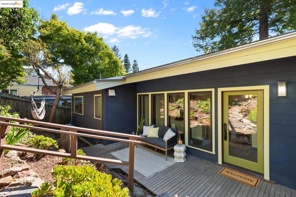 Serene mid-century oasis in the Berkeley Hills! Flooded with light from floor-to-ceiling windows, this airy 3BR/2BA lovingly updated and maintained home features an open floor plan, high ceilings, hardwood floors, a fireplace, and brand-new designer kitchen and bath remodels. Expansive tiered decks under mature foliage and fruit trees offer seamless indoor-outdoor flow, filtered Bay views, and a hot tub retreat. With a 2-car garage, abundant storage, and a private verdant setting, this is Berkeley Hills living at its best. Unbeatable location near parks, schools + top commuter routes, this extraordinary property is a private sanctuary!