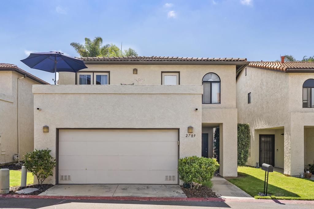 Welcome to 2789 Vista Del Oro— the lowest priced detached home in Carlsbad! Nestled in a quiet enclave of just 17 homes within the highly sought-after La Costa community of Patio Hills, long-term pride of ownership shines and indoor-outdoor living comes easy with 3 spacious patios substantially expanding your light-filled living space. The main level features an open-concept layout with a cozy fireplace centerpiece, crown molding, and plantation shutters. Sliding glass doors seamlessly connect the kitchen, dining, and living areas to your outdoor deck overlooking the (rarely ever used!) pool, perfect for entertaining. A 2-car garage with storage to spare and a main level half bath check all the boxes. Upstairs, the expansive primary suite has its own additional balcony, a walk-in closet, and large en-suite bath. Two additional bedrooms with full bath complete the upper level with yet another sizeable balcony overlooking the front of the home. Enjoy the best of living in a fully detached home— without the chore of grounds maintenance, which is taken care of by Patio Hills HOA. Located within the award-winning San Marcos School District and close to Carlsbad’s fabulous shopping, dining, parks, golf courses, and beaches. Don't miss the chance to capture this uniquely value-packed, lowest priced fully detached home for miles around, in one of San Diego's most desirable locales!