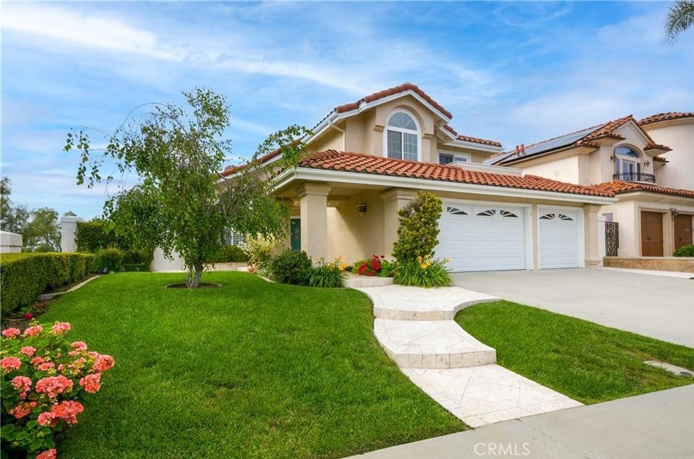 Located within the highly desired Palisades neighborhood sits this stunning, remodeled pool/spa home with 180-degree panoramic views, which is being offered fully furnished. Enjoy sunsets, canyons, and hill views with no sightlines from neighboring properties. The serene and private backyard is lushly landscaped and ideal for relaxing, swimming, and absorbing the amazing Southern California lifestyle. The backyard features a Pebble Tec pool and spa, custom paver decking, and multiple seating areas for maximum enjoyment. Offering 4 bedrooms (one on the main level), 3 full baths (one on the main level), and a large 3-car garage with great storage, this home is spacious and completely remodeled. Rich hardwood floors greet you in the foyer and throughout the family room, kitchen, and formal dining room. The gorgeous gourmet kitchen boasts bay window views of the beautiful backyard and beyond and offers Quartz countertops, custom cabinetry, top-of-the-line Viking and GE appliances, and eat-in options at the custom island and the pier countertop. The kitchen can be offered fully equipped with utensils and dishware/cookware, etc. The family room features a stacked-stone fireplace, custom mantle, big screen TV, and cozy sectional. The great room layout is the perfect place for everyone to relax together. The full bathroom next to the main floor bedroom/office offers a beautiful vanity and stone finishes. The large living room adds to the great flow of this home for family or entertaining. Now stroll up the gorgeous, hardwood staircase to the spacious primary bedroom and bathroom that provide expansive views. Step out on the upstairs deck to enjoy morning coffee or a beautiful sunset. This retreat offers 2 walk-in closets and a remodeled bathroom including tumbled marble shower with custom glass enclosure, Jacuzzi jetted tub, Corian counters, dual sinks, and travertine floors. The third bathroom has a custom vanity with marble countertop and tumbled-marble tile surround in the tub/shower. Two bedrooms upstairs face the front and one offers a large balcony great for watching the sunrise! The property has a new HVAC system with UV electronic air scrubber, new water heater, and was recently re-piped. This property is very special! The location is amazing with the privacy and tranquility we all desire, the views to calm the soul, and the space to be with family & friends all year round. Fully furnished and stocked for all your needs, come on in! It's really beautiful!
