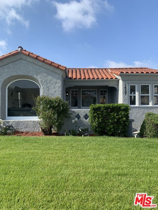 Very beautiful spacious Spanish style house with remodeled kitchen and bathrooms, gas fireplace in living room, central air, central heat, vinyl flooring, brand new appliances, formal dining room, and breakfast room located in a nice area on a tree lined street. Long driveway, gated back yard with a two car garage and a separate legal Rec. Room in the rear that can easily be converted into an ADU, can also be used as is for a private office, gym, or game room.