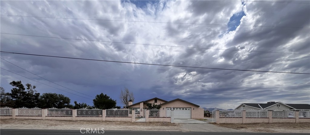 Charming 4-bed, 2-bath ranch-style home on a fully fenced, gated lot in peaceful Littlerock! This well-maintained property features an open-concept layout, cozy fireplace, granite kitchen countertops, and updated appliances. Sitting on a spacious flat lot with room for horses, farming, RV parking, or expansion. Detached garage/workshop included. Zoned for animals and ideal for rural living with modern convenience. Minutes from schools, shopping, and dining. A must-see for those seeking space and serenity! Permitted Patio and a Gazebo great for entertainment.