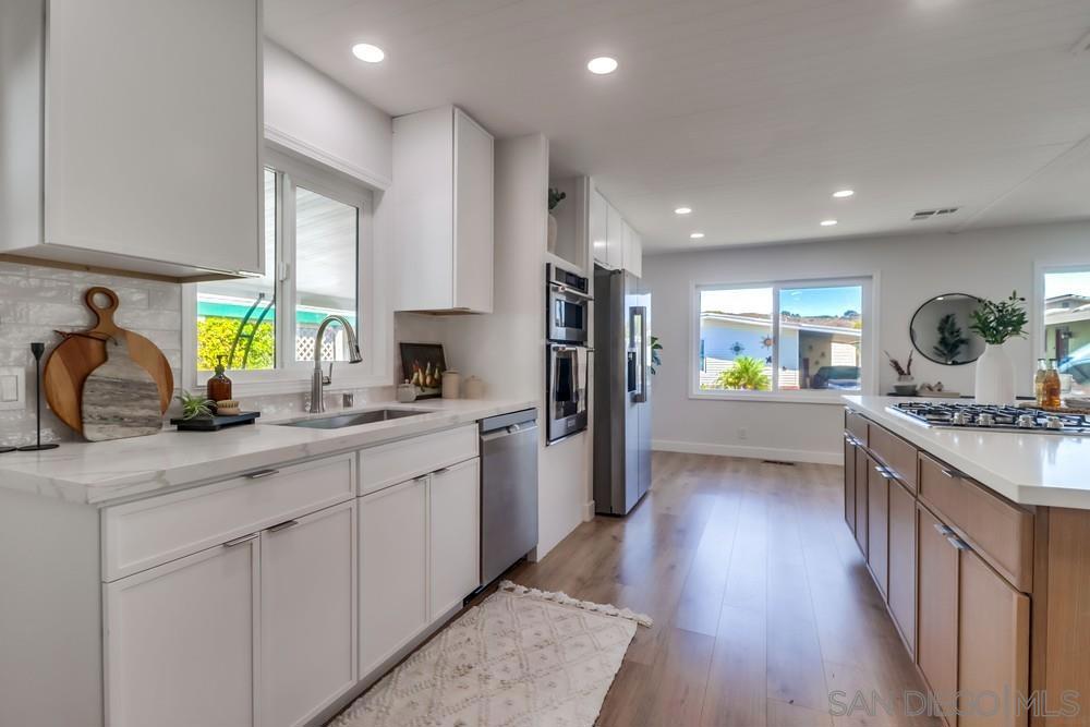 Remodeled inside and out in 2025! Beautifully updated manufactured home in one of the best locations in Rancho Carlsbad. Views out to the golf course and rolling hills. Large covered deck and private backyard with fruit trees. Interior and exterior of this home were extensively remodeled with high end materials to create a serene and neutral living space. New windows and slider door. Freshly painted inside and out. Can recessed lighting installed and new drywall throughout home. Kitchen was opened up to create an eat in island and open concept flow to the dining and family rooms. Both bathrooms were tastefully remodeled and include new fixtures, new showers, free standing vanities and a built in make-up station in the primary with ample storage. Move in and start enjoying the sought after 55 plus community amenities including golf course, clubhouse, tennis and pickleball courts, community pool, sauna, gym, hot tub, ping pong, dog park, RV storage and more. You own the land and pay NO SPACE RENT. 24 hour guard gate and onsite management. Only minutes from Carlsbad Village and the beach. Includes a generous carport for parking and a bonus room that could be used as a shed, storage or workroom. See supplement for upgrade details. This is the one you have been waiting for! Remodeled inside and out in 2025! Beautifully updated manufactured home in one of the best locations in Rancho Carlsbad. Views out to the golf course and rolling hills. Large covered deck and private backyard with fruit trees. Interior and exterior of this home were extensively remodeled with high end materials to create a serene and neutral living space. New windows and slider door. Freshly painted inside and out. Can recessed lighting installed and new drywall throughout home. Kitchen was opened up to create an eat in island and open concept flow to the dining and family rooms. Both bathrooms were tastefully remodeled and include new plumbing fixtures, new showers, free standing vanities and a built in make-up station in the primary with ample storage. Move in and start enjoying the sought after 55 plus community amenities including golf course, clubhouse, tennis and pickleball courts, community pool, sauna, gym, hot tub, ping pong, dog park, RV storage and more. You own the land and pay NO SPACE RENT. 24 hour guard gate and onsite management. Only minutes from Carlsbad Village and the beach. Includes a generous carport for parking and a bonus room that could be used as a shed, storage or workroom. See supplement for upgrade details. This is the one you have been waiting for!