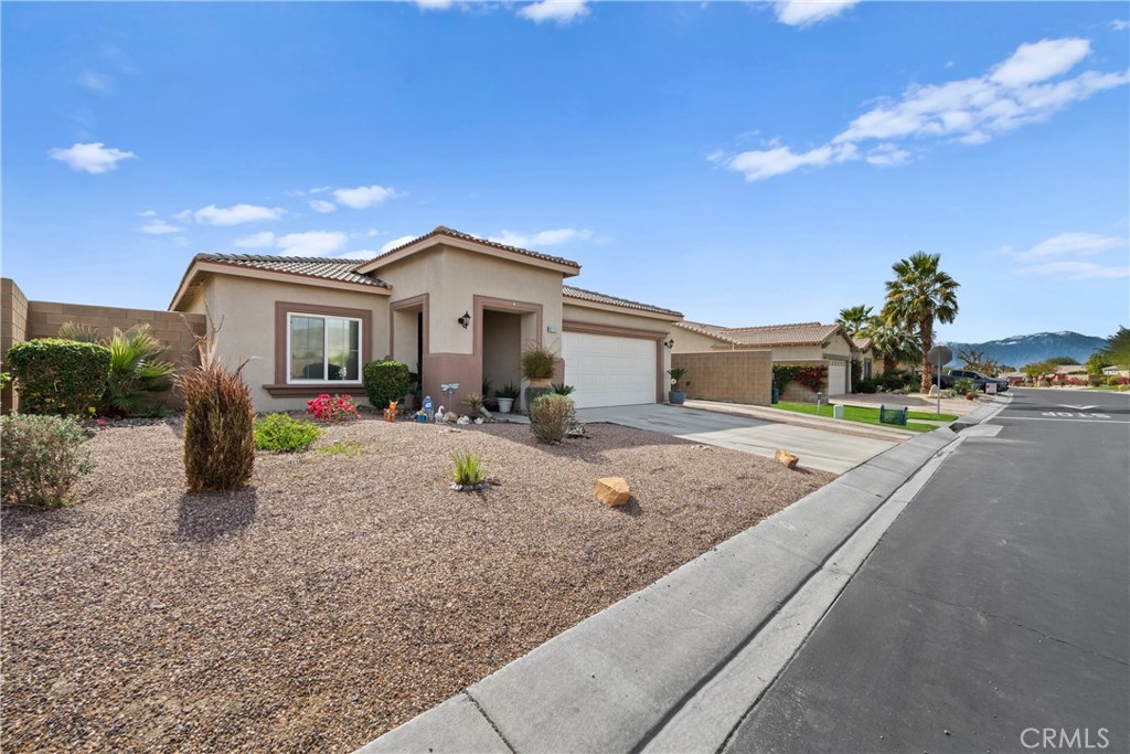 This amazing Indio home has everything! This is a one of a kind property with RV Parking, a PRIVATE pool, a CASITA and its in a gated community. The moment you walk into the door, you will appreciate the open concept layout. The kitchen has a ton of cabinet space and a large kitchen island which opens up to your spacious living room. Both guest bedrooms in the main home are spacious and share a sizable guest bathroom. The master suite offers a walk in shower as a well as a private glass slider to your resort-like backyard. In the backyard you will find an alumawood patio cover that covers the length of the property as well as your private pool making this property perfect for family gatherings and a relaxing lifestyle. The casita offers a large studio-type room with its own private bathroom as well! Schedule your tour today!