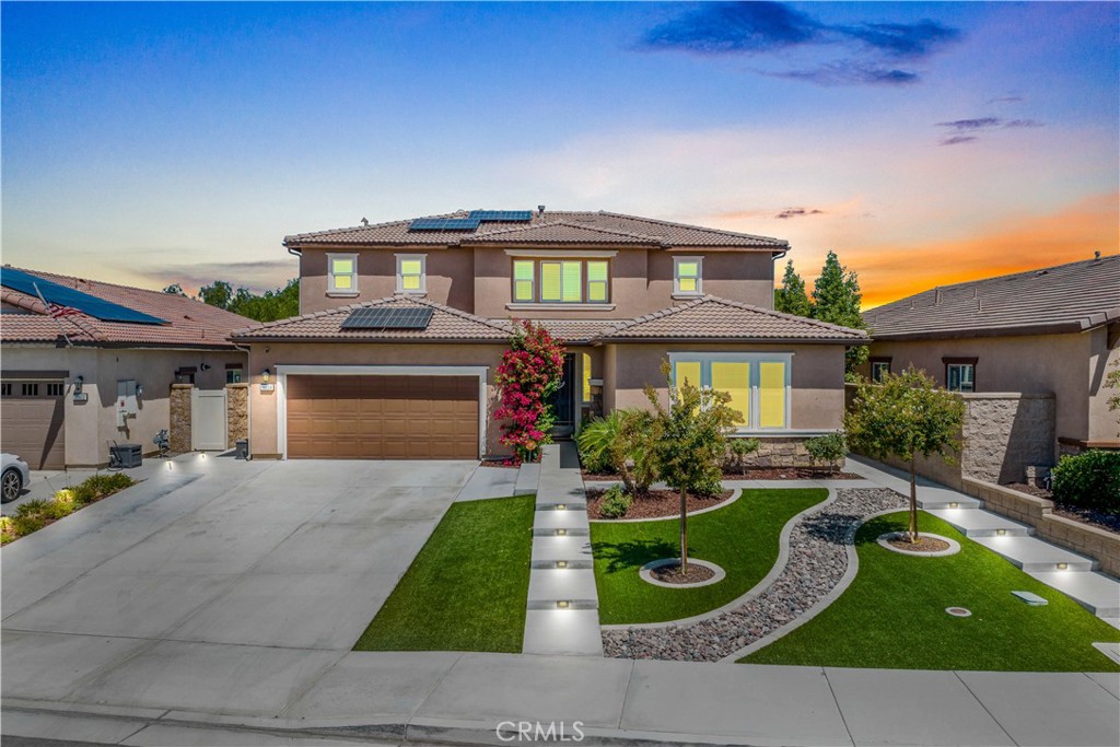 Welcome to 30834 Midnight Moon Lane, a stunning residence where thoughtful design meets elevated comfort. This spacious home offers a rare combination of multi-generational flexibility and resort-style outdoor living, perfect for families, entertainers, or those seeking income potential. With nearly 3000 square feet of spacious living, 5 bedrooms and 4 full bathrooms - this home checks all the boxes! Inside, the gourmet kitchen is a showstopper, featuring sleek quartz countertops, stainless steel appliances, a built-in range, walk-in pantry, and custom pendant lighting above the expansive island. The open concept living area flows seamlessly into the family room, complete with a built-in media cabinet for stylish functionality. Modern finishes, abundant natural light, and a smart layout make everyday living both elegant and efficient. Off the family room is a lovely first level bedroom and full bathroom. On the opposite side of the home is the highly sought-after Next Gen suite! This rare find includes its own private entrance, family room, full bathroom, stackable washer and dryer, and direct access to a private patio—ideal for extended family, guests, or rental income opportunities. Upstairs you will locate a large loft and 2 other very roomy bedrooms and another full bathroom. Stunning Primary Suite offers all the space you'll need including a beautiful Primary Bathroom complete with dual vanities, deep soaking tub, walk-in shower and walk-in closet. Rounding out the second level is a massive laundry room loaded with tons of cabinets for all your storage needs. Step outside to your personal oasis: a saltwater pool and spa with pebble tech finish and vibrant blue tile, surrounded by multiple seating areas and lush privacy with no rear neighbors. The Alumiwood patio cover with pull-down shades, ceiling fan, and garden planter creates a perfect space for relaxing or entertaining year-round. Additional highlights include paid-off solar panels for energy savings, mountain views, and a prime location near parks, top-rated schools, and shopping. This home isn’t just a place to live—it’s a lifestyle to love. Spencer's Crossing offers all the amenities you want, Clubhouse, Multiple Pools, Outdoor Picnic spots, tot lots, sports parks and courts and walking trails. Minutes from Temecula Wine Country.