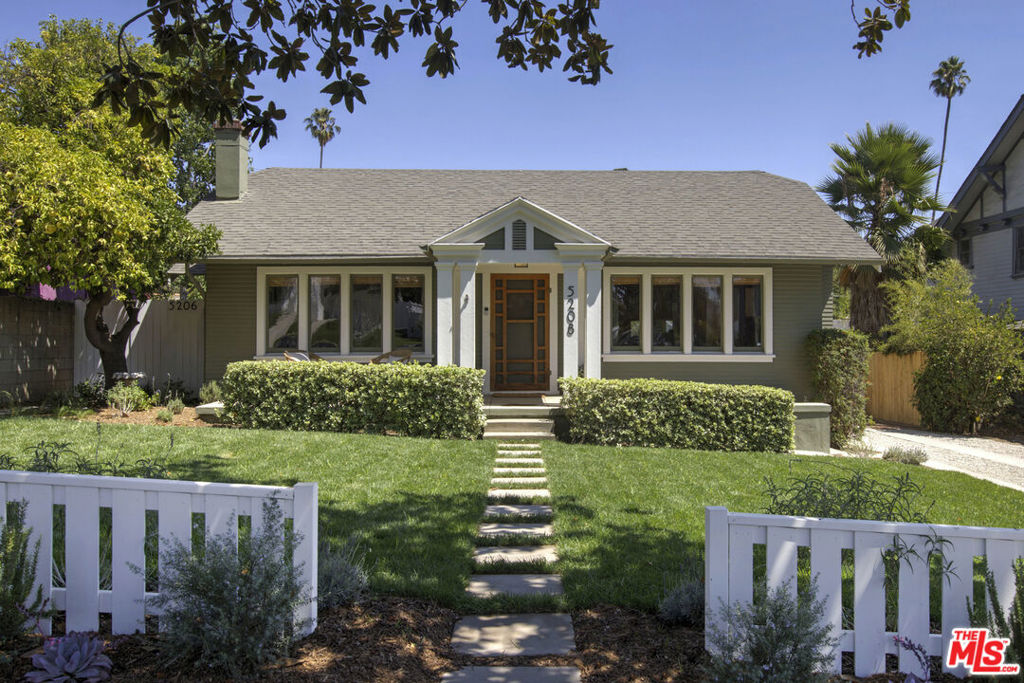 Located in the heart of Eagle Rock north of Colorado, 5208 Maywood is a beautifully restored and thoughtfully updated 1922 Craftsman compound with main house, guest house, standalone office/gym and recording studio on a private, gated, flat quarter-acre lot. The sellers are the third owners and put tremendous care into preserving original details while thoughtfully upgrading for modern comforts throughout. The 2 bed / 2 bath home features a vintage Batchelder tile wood-burning fireplace, refinished original wood floors and built ins, restored windows, along with a new kitchen, remodeled bathrooms, and adding a new central HVAC system, tankless water heater, upgraded 200-amp electrical, full plumbing and sewer replacement, and foundation upgrade. The sunny cheerful 1 bed / 1 bath guest house has its own address, private entrance, and fenced yard, updated with a new kitchen, refinished wood floors, restored cabinets, updated lighting fixtures, split-duct HVAC, new plumbing and sewer line. Formerly a five-car garage, the detached space now includes a two-car garage with storage, space for a gym or home office, and a stunning light-filled recording studio with 15 foot ceilings, skylights, antique French doors and windows, custom sound panels, 100-amp sub panel, Rockwool Safe'n'Sound insulation, split-duct HVAC, new roof, and siding. The peaceful and private grounds are vast, dotted with mature fruit trees including grapefruit, lemon, pomegranate, and a 100-year-old orange tree, which provides shade for an expansive back patio made from antique bricks collected by the original owner. The front yard features new sod and drought-tolerant landscaping with irrigation, raised garden beds, and rosemary and lavender can be found throughout the property. This rare and versatile property sits just below Hill Drive, minutes from the shops and restaurants that make Eagle Rock so special.